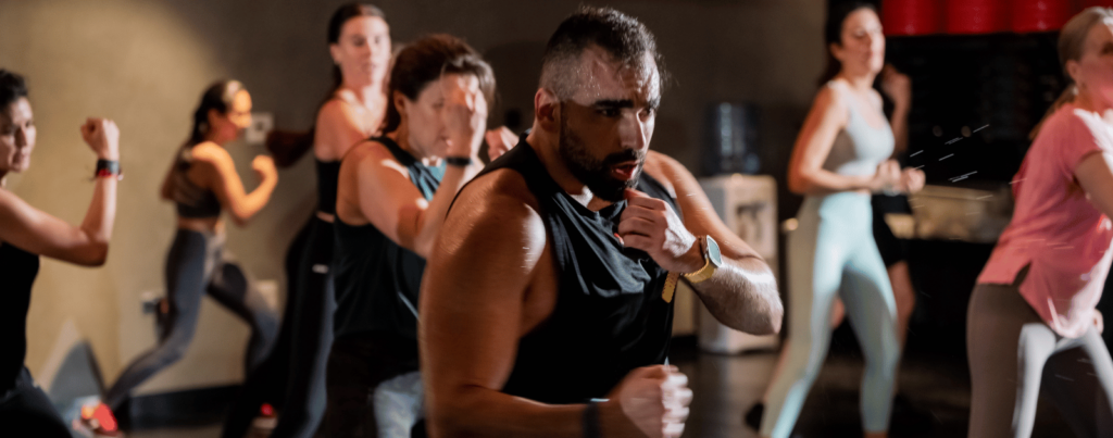 a set of people training body combat in studio republik